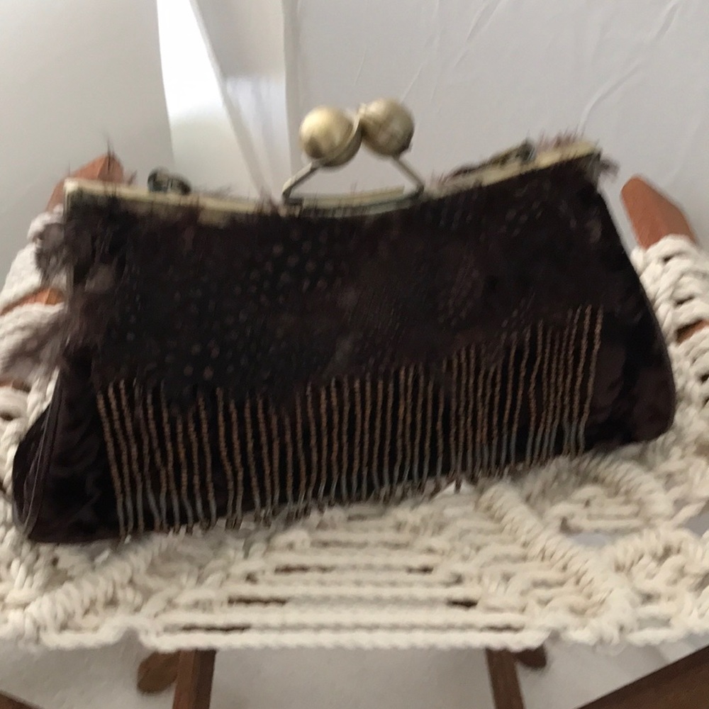 Velvet handbag with feathers and tassles